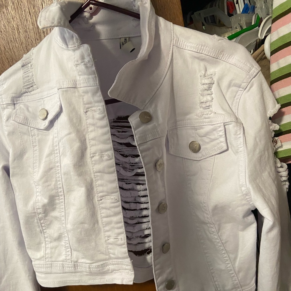 White ripped jean jacket